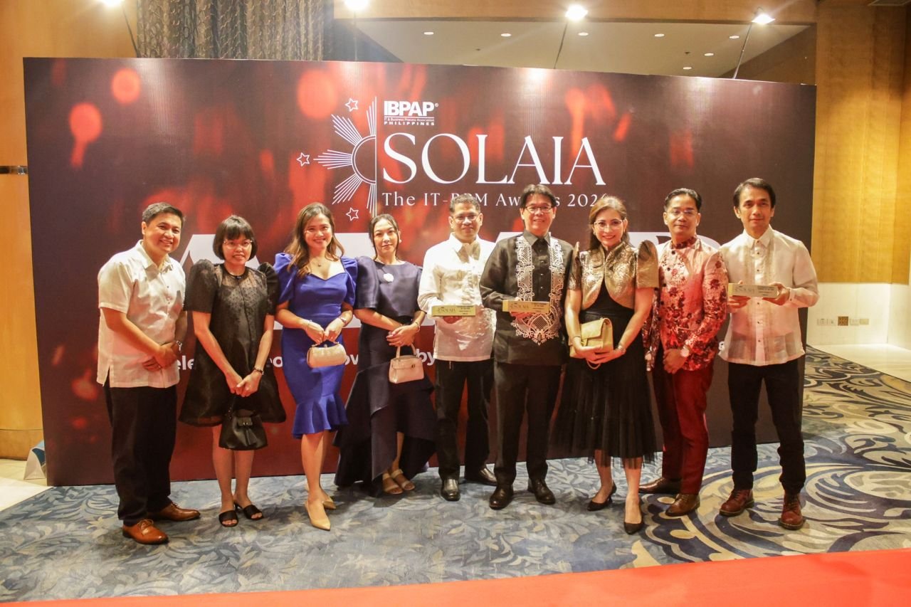 OpenText Philippines representatives in formal Filipino attire at the SOLAIA awards night